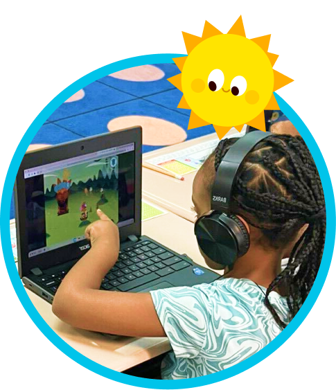 A child plays Teach Your Monster to Read on a laptop.