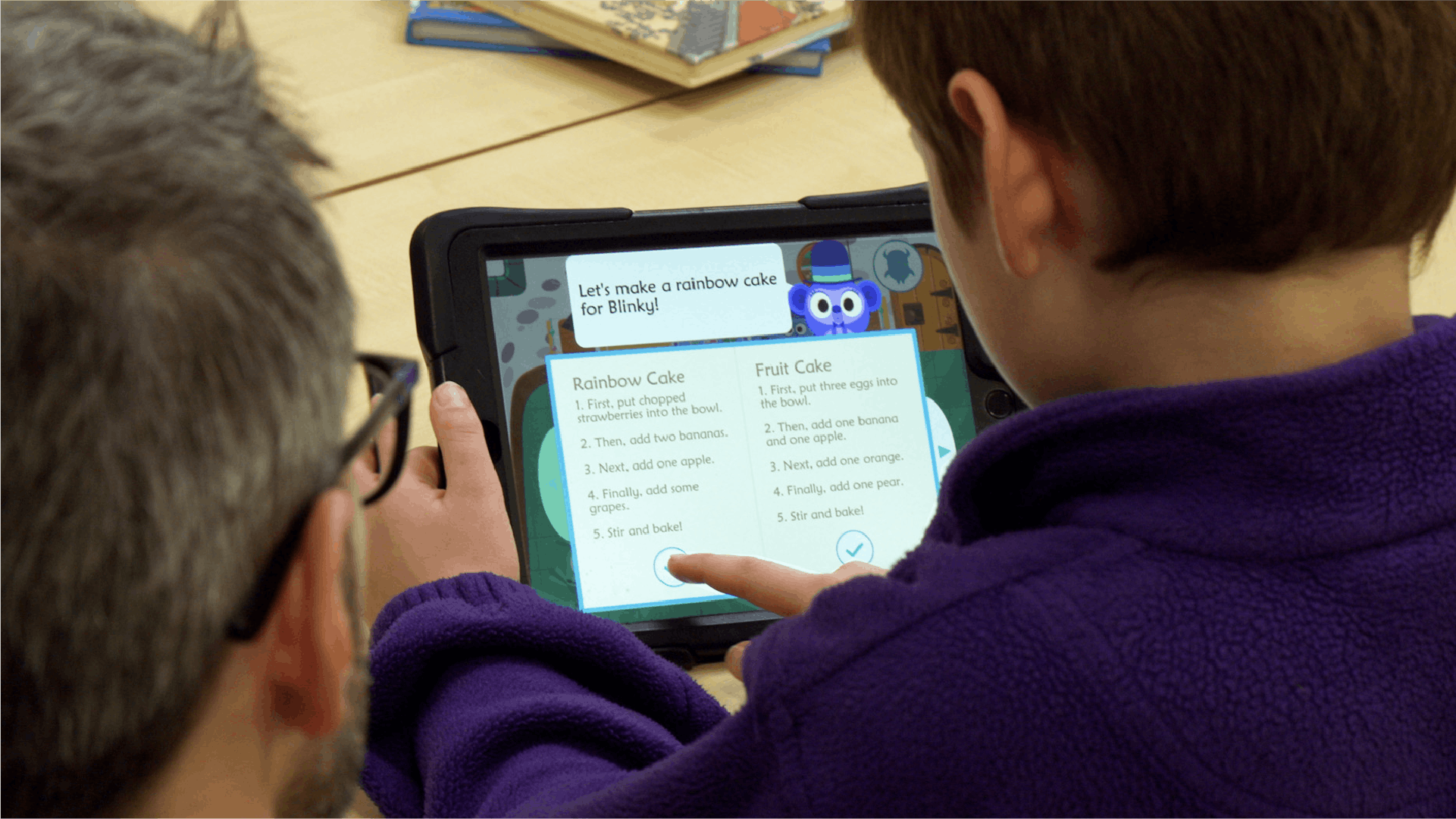 A child reading a recipe from the game on iPad