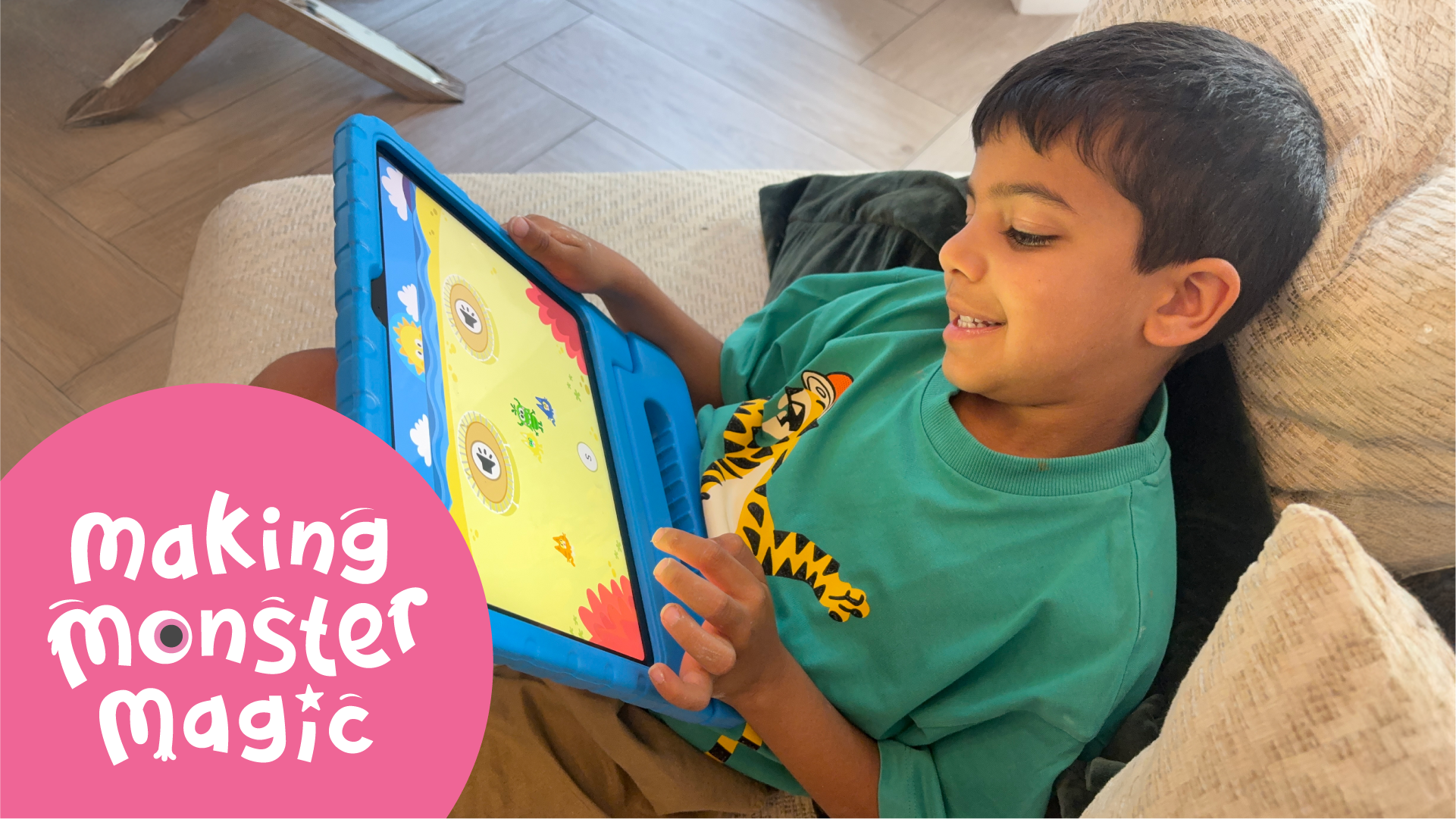 A boy plays the new Teach Your Monster to read on an iPad